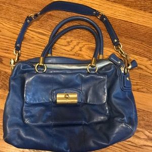 Leather coach handbag.